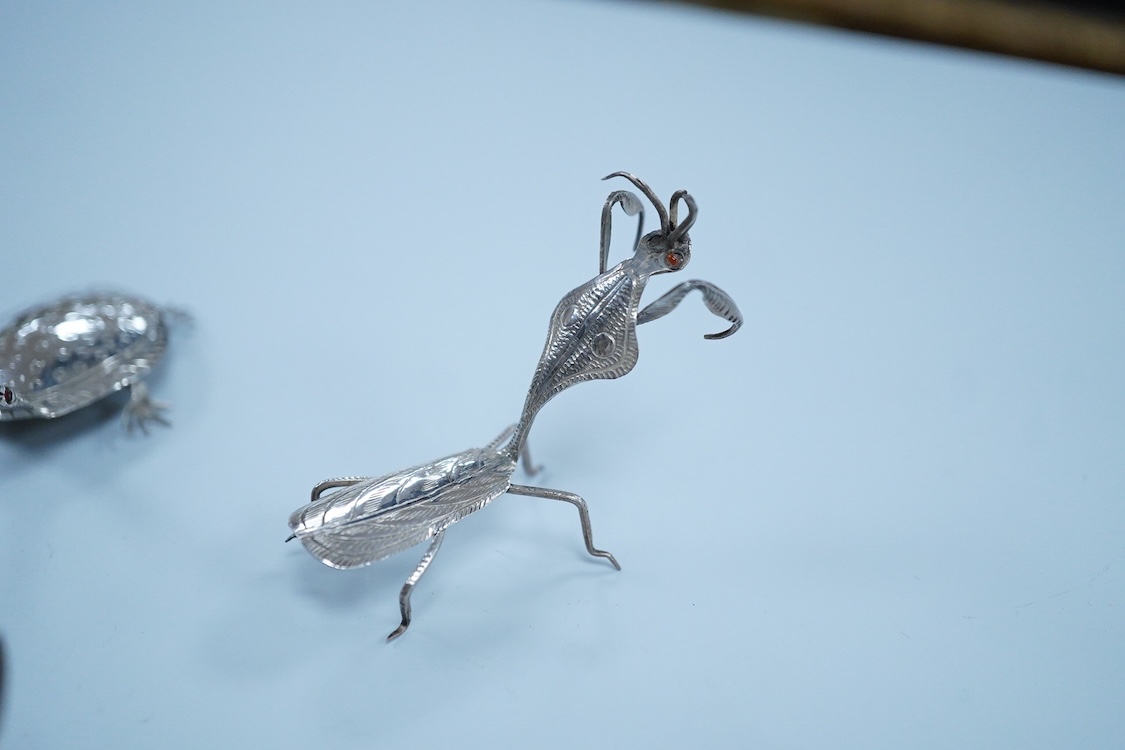 Six Thai or Malaysian white metal models of creatures, to include a Praying Mantis, height 45mm, a tortoise, a dragonfly, a butterfly, a lizard and a beetle.